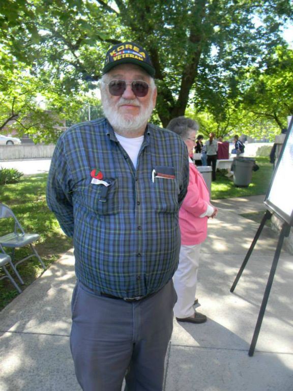 Image of veteran smiling, under a tree